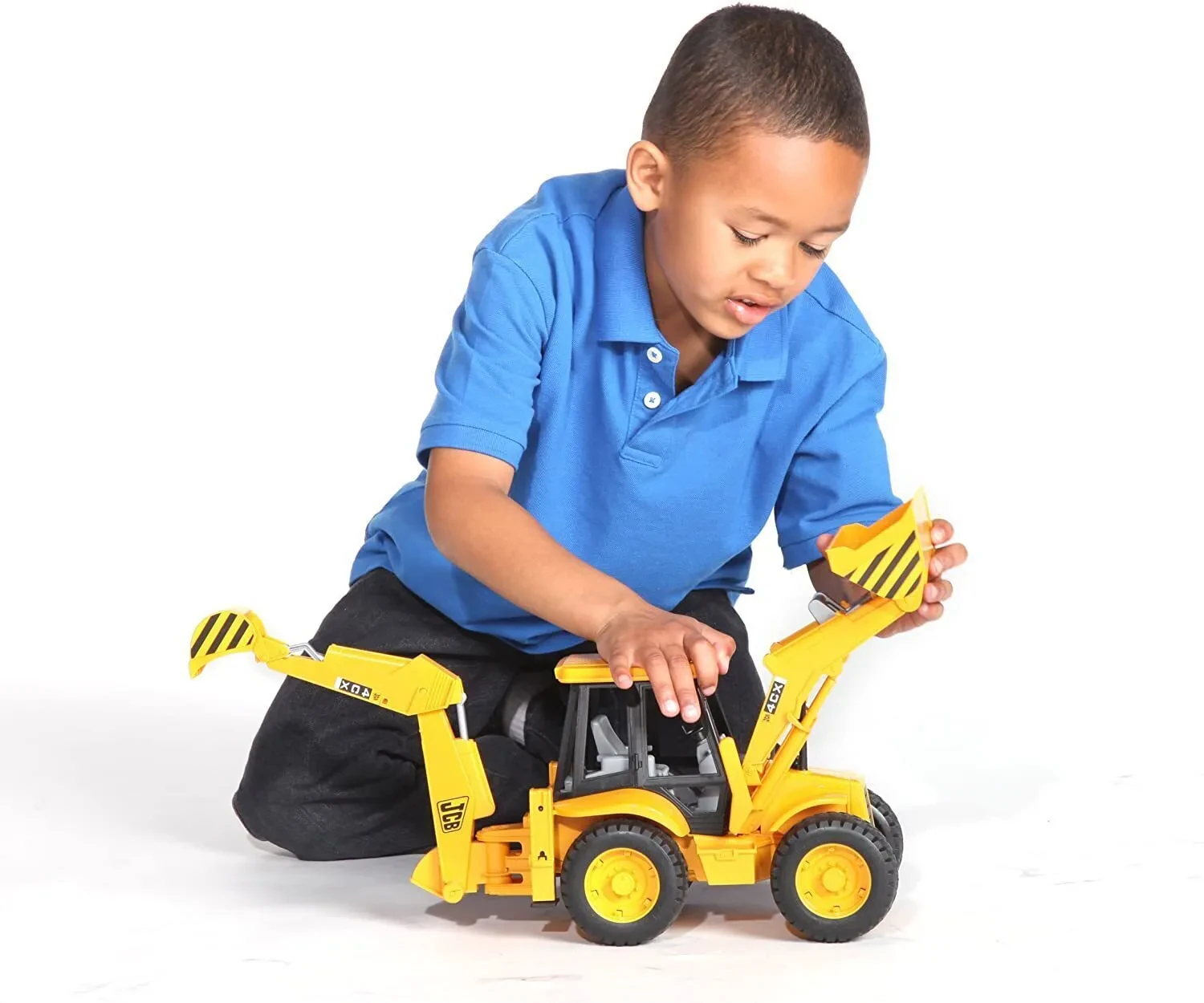 Child playing with 1 16 scale backhoe
