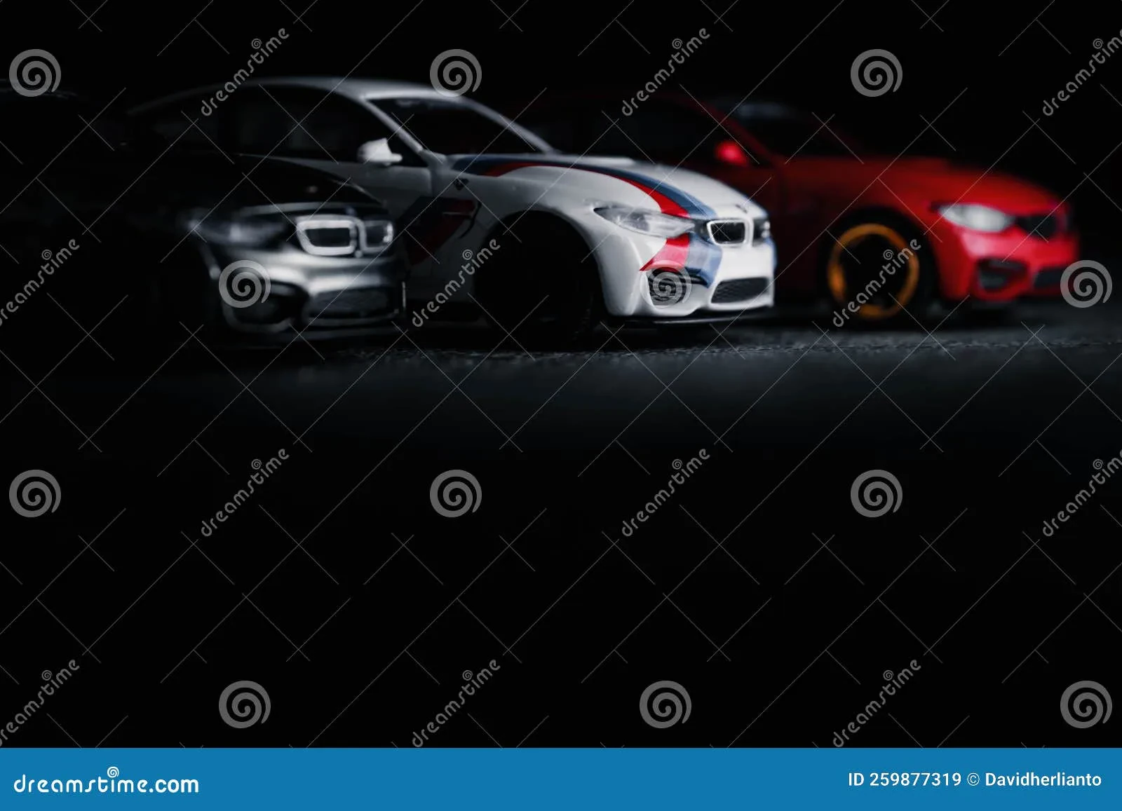 Different scales of BMW 330Ci diecast models