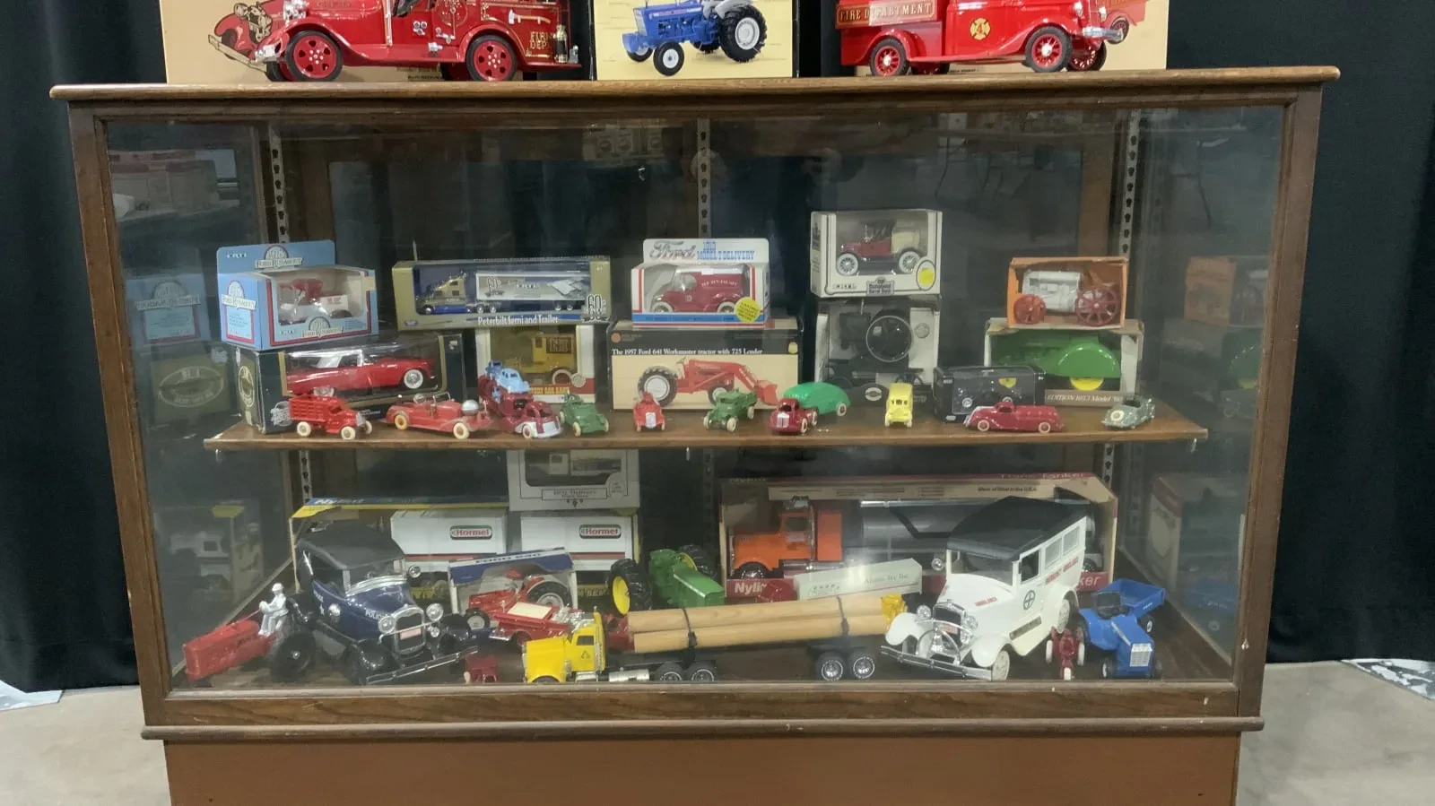 Antique store display case with vintage toys