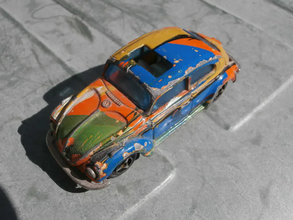 damaged diecast car before restoration